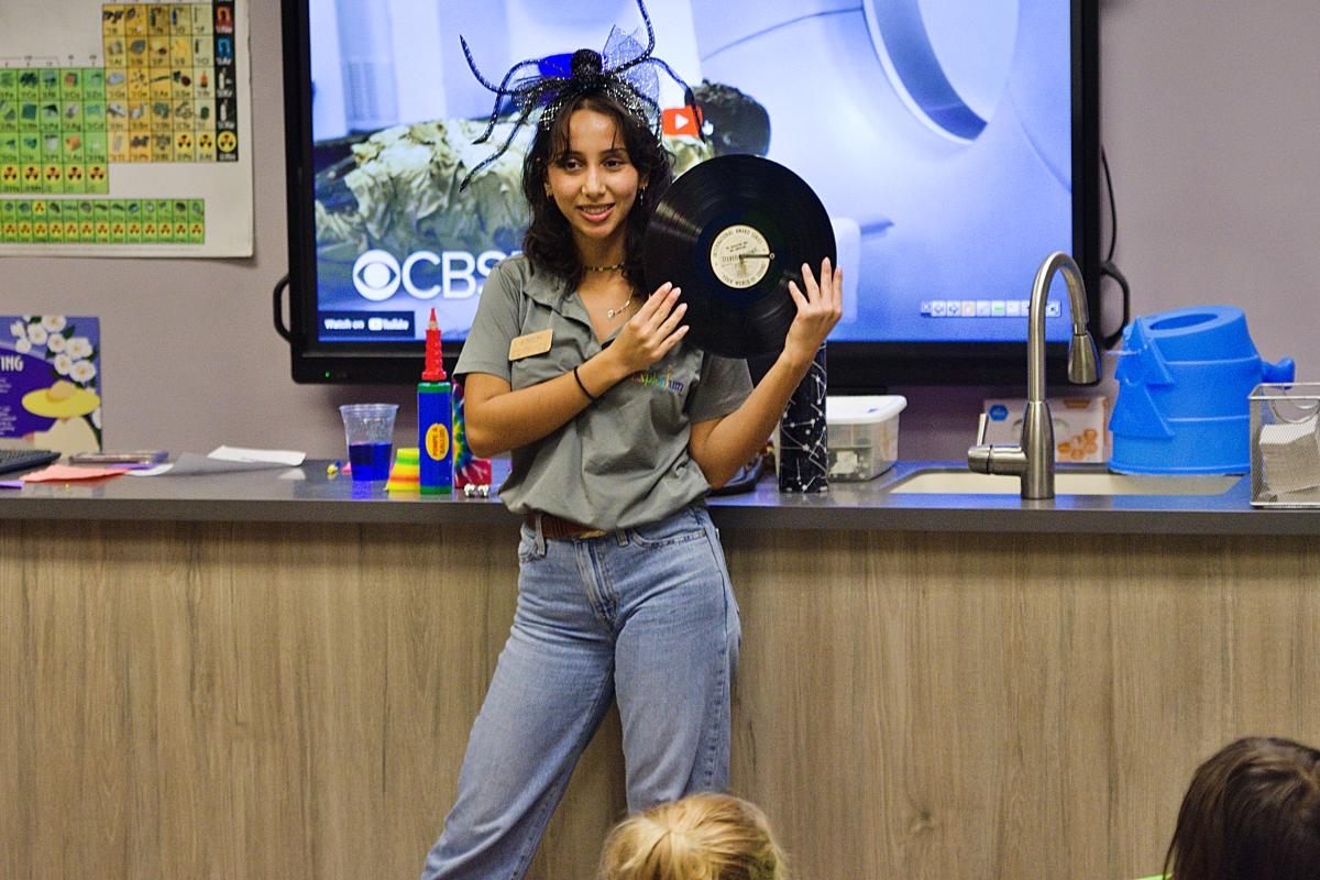 Eren displays a record as part of the Spooky Sounds demonstration