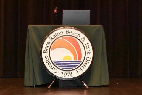 District seal in front of new desk