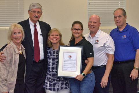 District Commissioners present Lin Hurley with her Award.