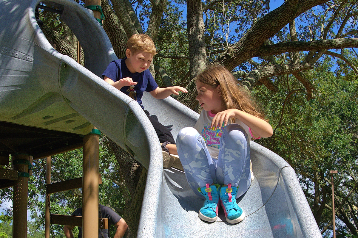 Kira and Jordan Ogman on a slide