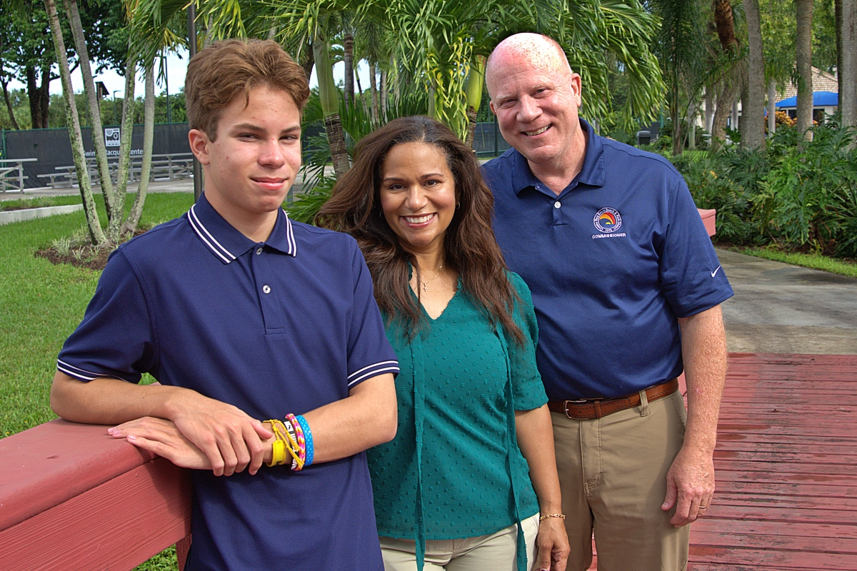 Commissioner Craig Ehrnst (left) with wife Julissa and son Eric