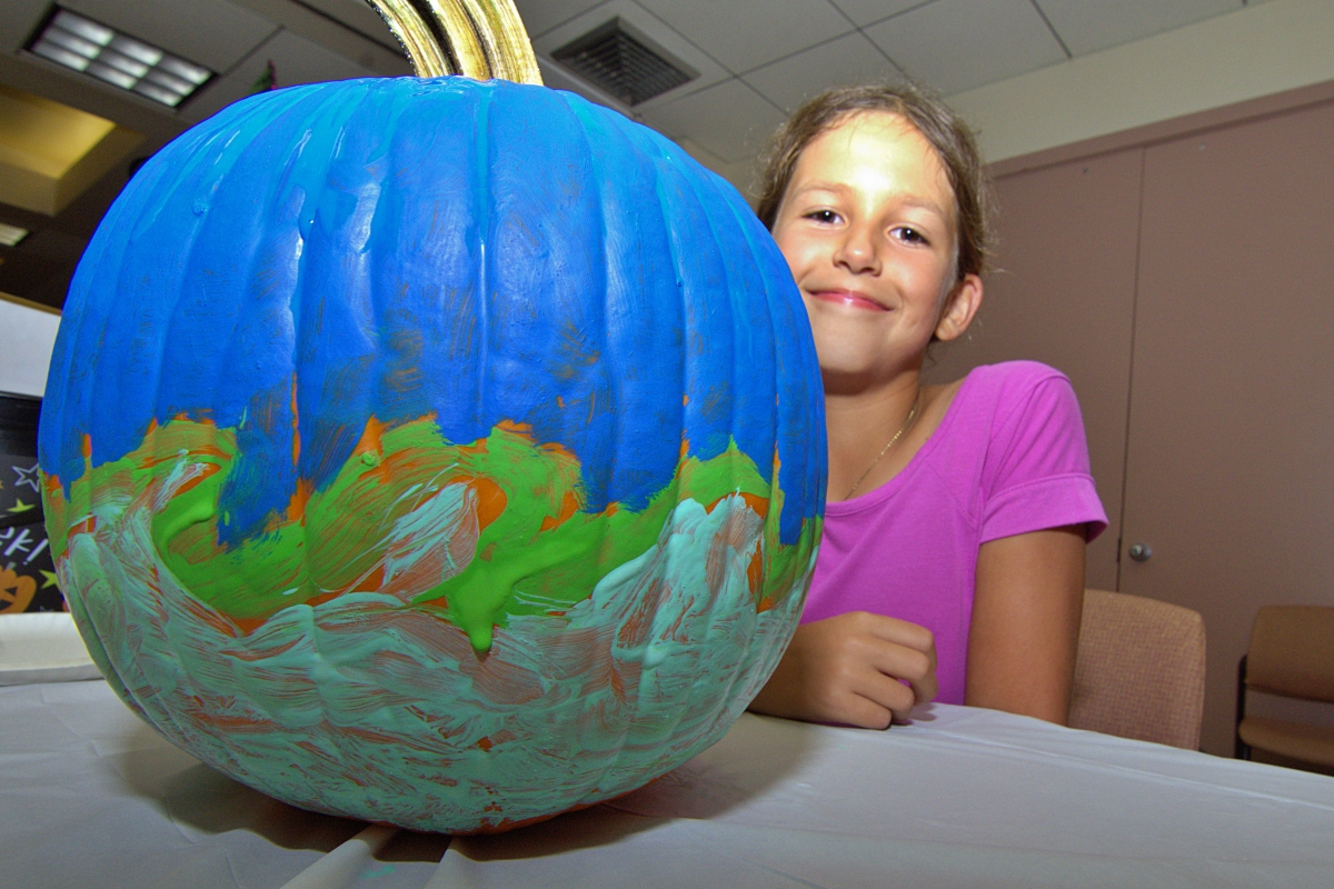 Girl with blue pumpkin