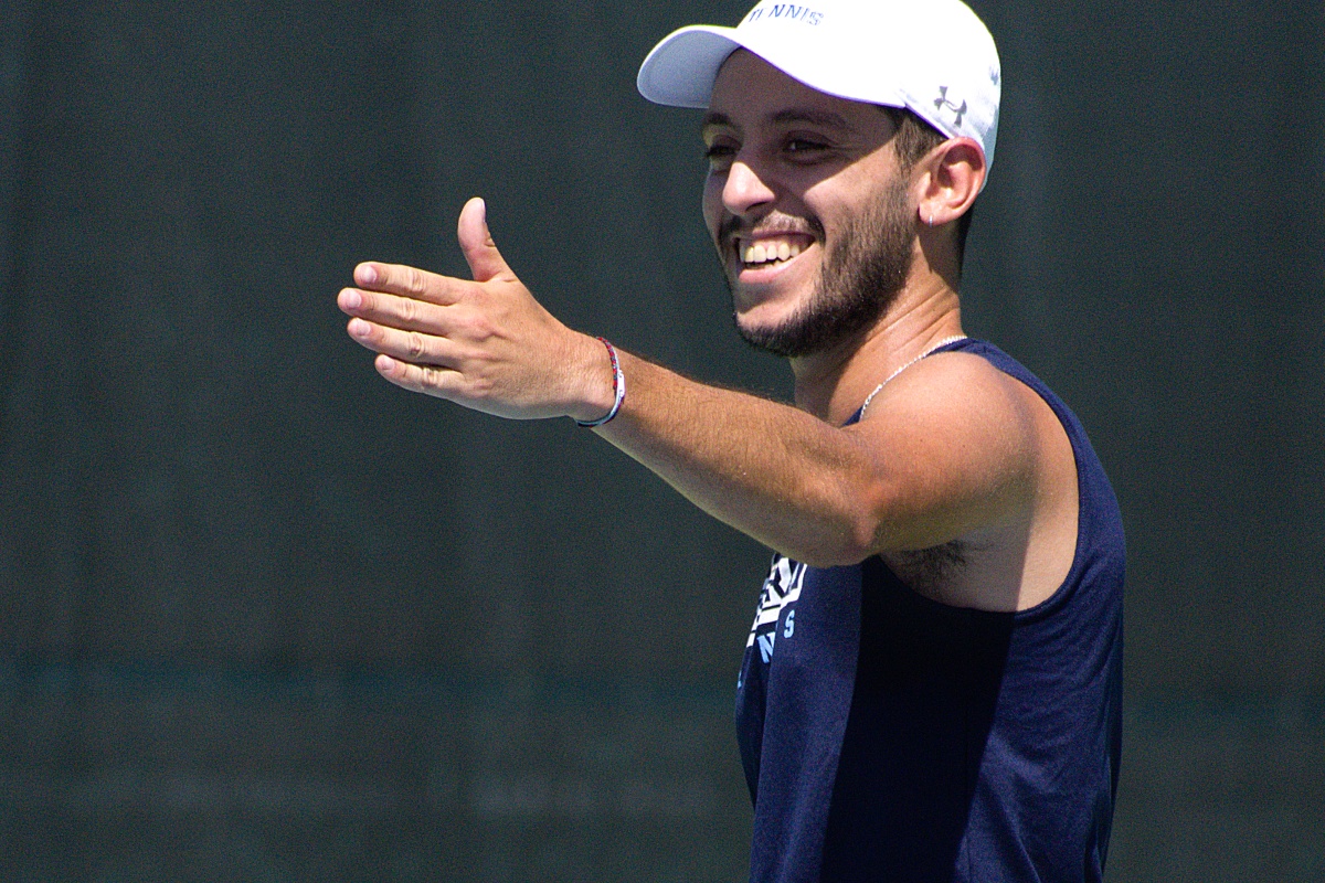 Keiser's Soufiane El Mesbahi smiles after winning his match,