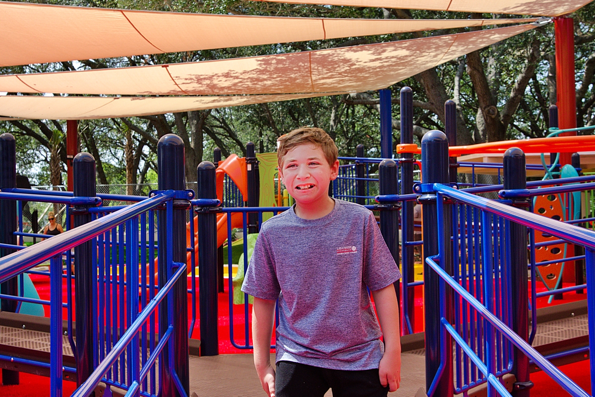 Jordan Ogman enjoys one of the playground's new features