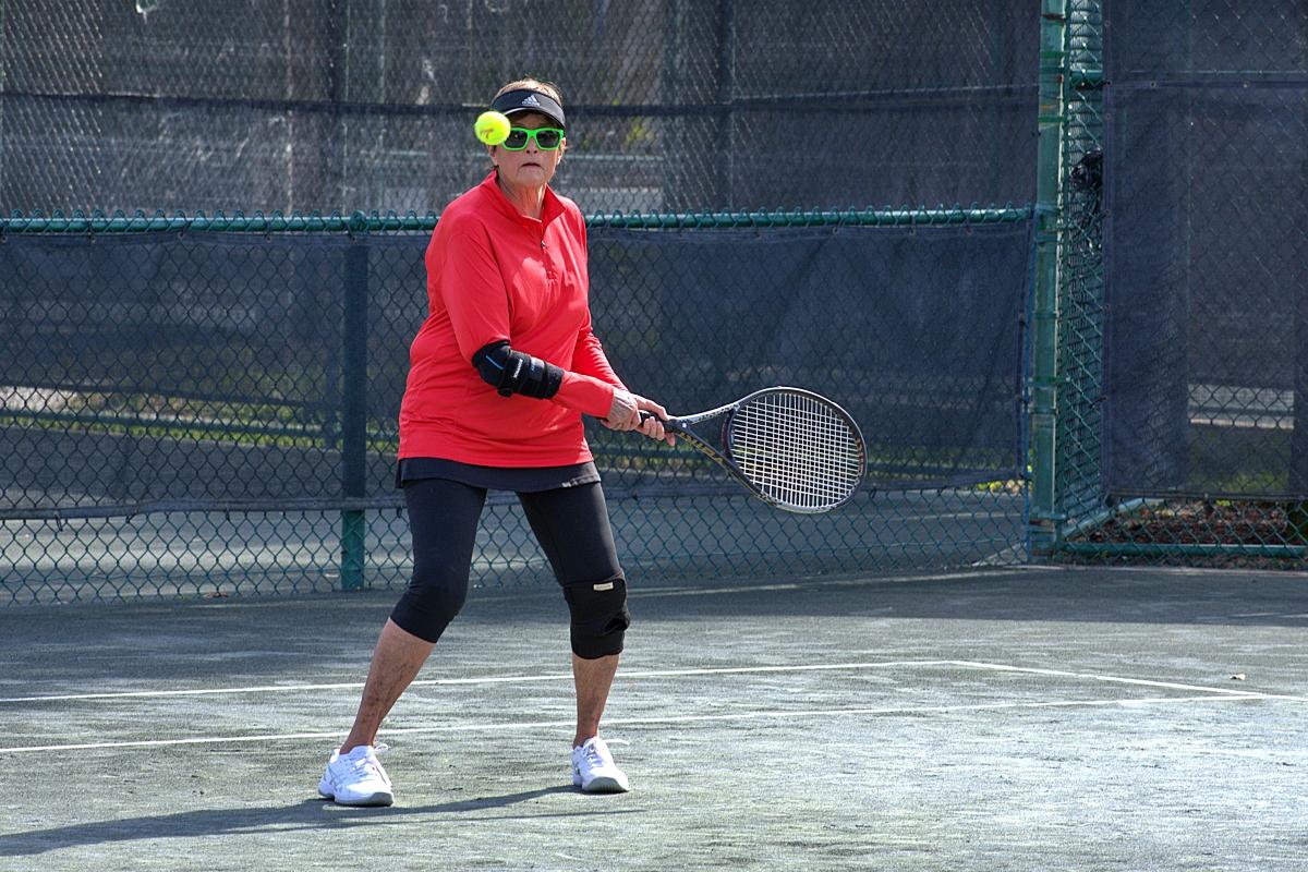 A female player keeping her eye on the ball