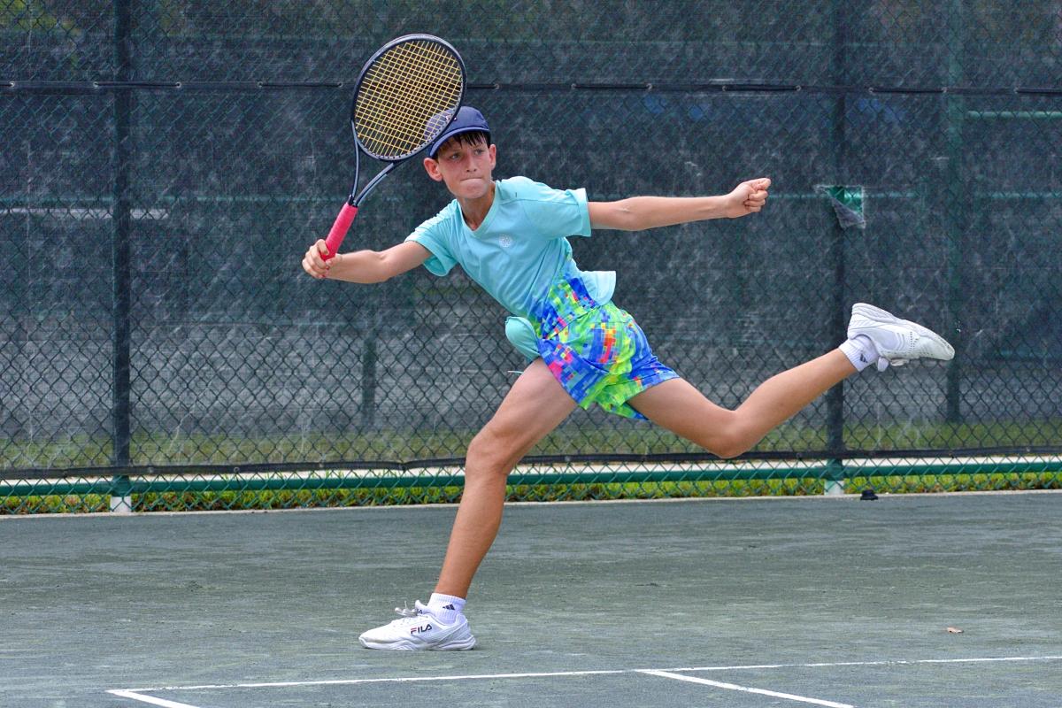 Michael Livson follows through after a forehand