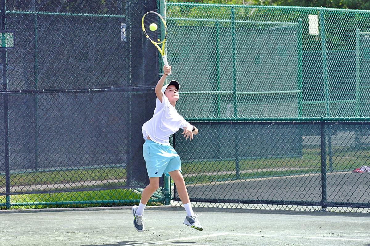 Junior boy with a leaping shot