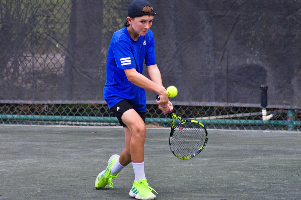Selwyn's opponent with a backhand