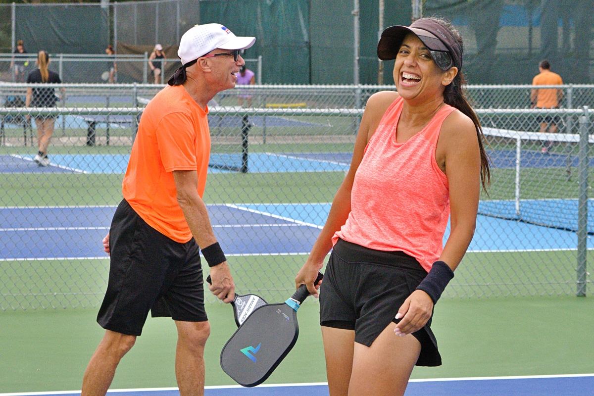 Laughing with a partner at Pickleboo