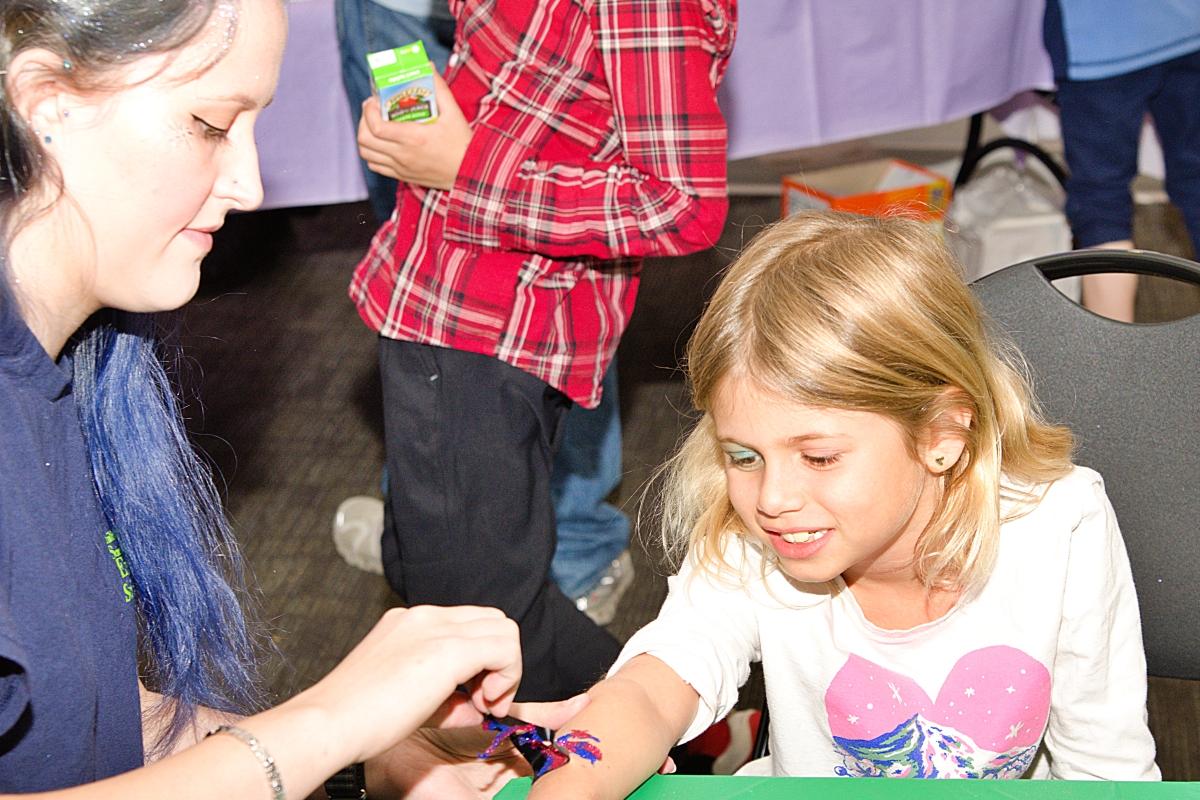 Getting a glitter tattoo