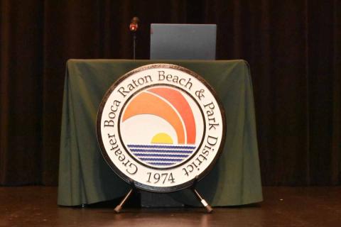 District seal in front of new desk