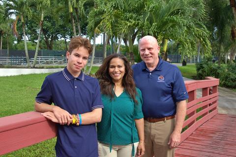 Commissioner Craig Ehrnst (right) with wife Julissa and son Eric