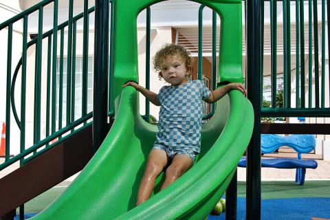 Packer Zitzmann on the Swim and Racquet Center playground slide
